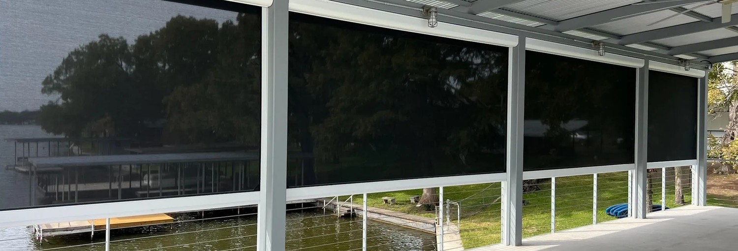 Motorized outdoor zip shades on a lake house boat dock Outdoor Shades USA